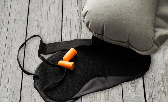 The eye mask is recommended, but try it before leaving to be sure that the elastic does not tighten you too much. Earplugs and ear muffs are also highly recommended.