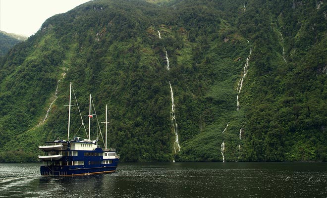 The rain which falls almost daily feeds small lakes which pour ephemeral cascades into the fiord.