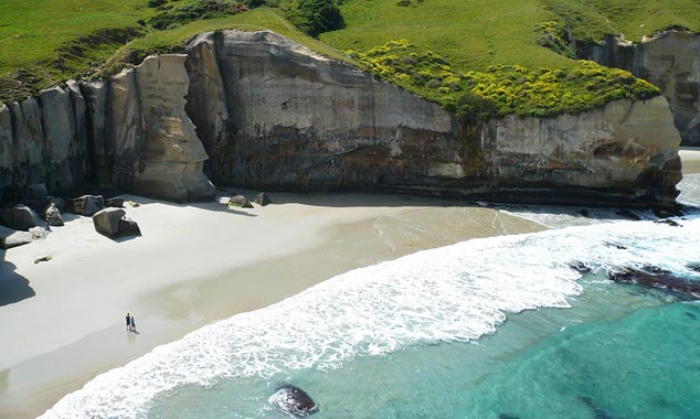 The limestone cliffs are sculpted by erosion.