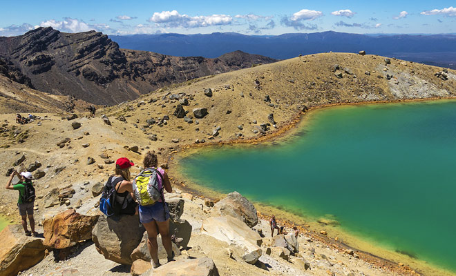 Tongariro Crossing hikers will be rewarded for their efforts with the beauty of the turquoise lakes of the central crater and then the blue lake midway.