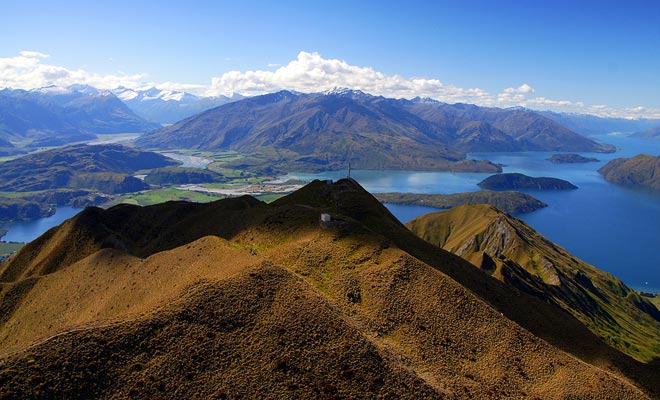 The top of Rocky Mountain offers stunning views of the lake and mountains of the area.