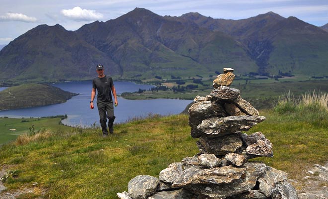 It is a custom to stack rocks on top of a mountain. You can bring your stone to the building at the top of Rocky Mountain.