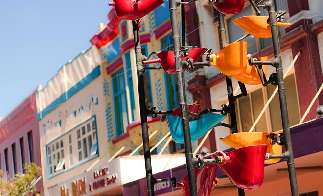 This very colorful contemporary artwork is a moving fountain. It is the emblem of Cuba Street.